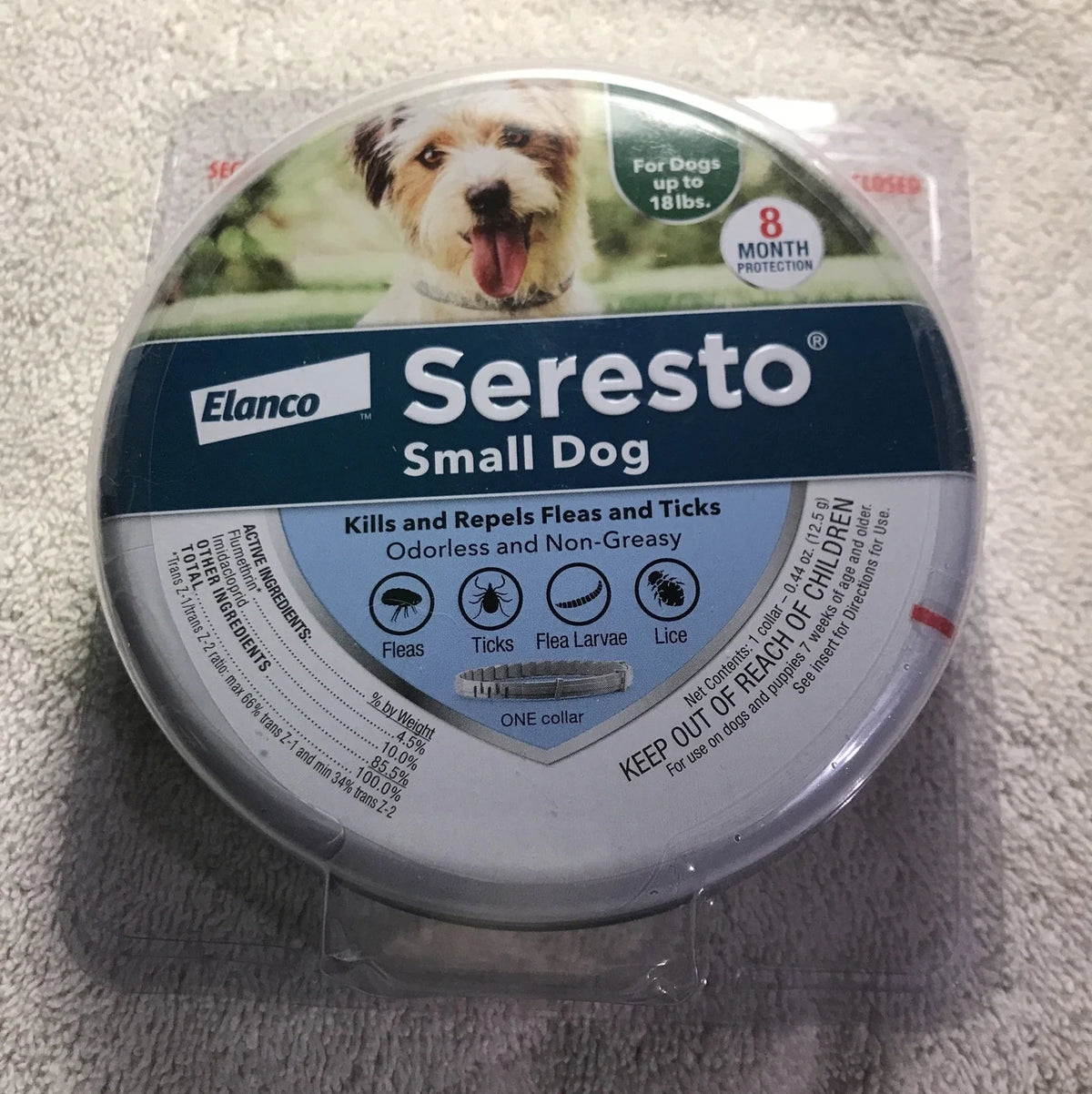 Seresto Small Dog Flea and tick collar tin, blue and silver with a dog portrait and 8-month protection badge