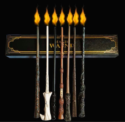 Harry Potter Magic Fireball wand set with six ornate wands in dark, white, brown and black finishes, shown with flame effects and a decorative box.